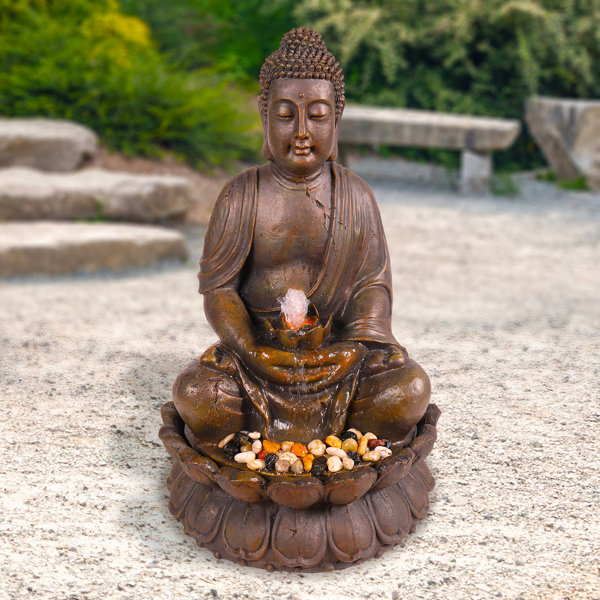 resin meditating buddha on column patio fountain with led light